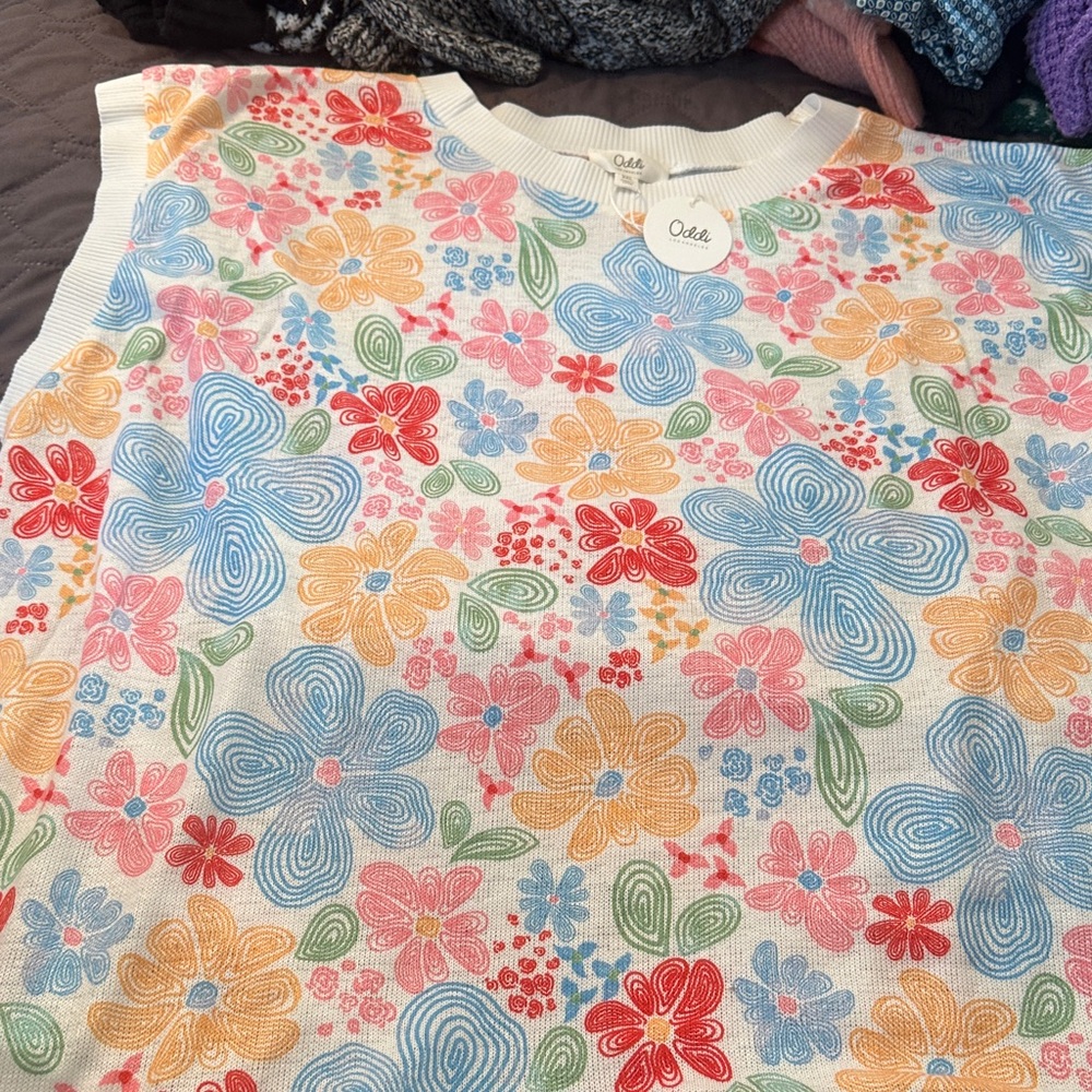 Sleeveless sweater. Never worn